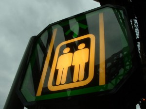 Photo of a sign depicting two generic male images