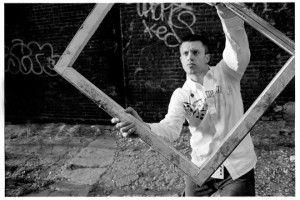 Photo of man holding empty frame