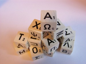 Photo of dice with Latin and Greek letters on them