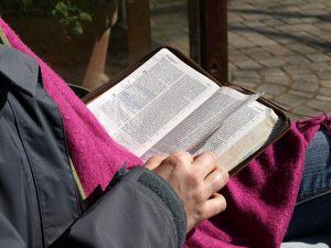 Photo of someone reading a Bible