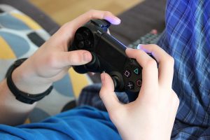 Photo of hands gripping a gamepad