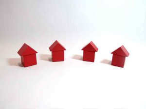 Abstract photo of four little houses next to each other